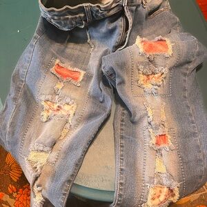 Distressed Blue Jeans with colorful faded accents